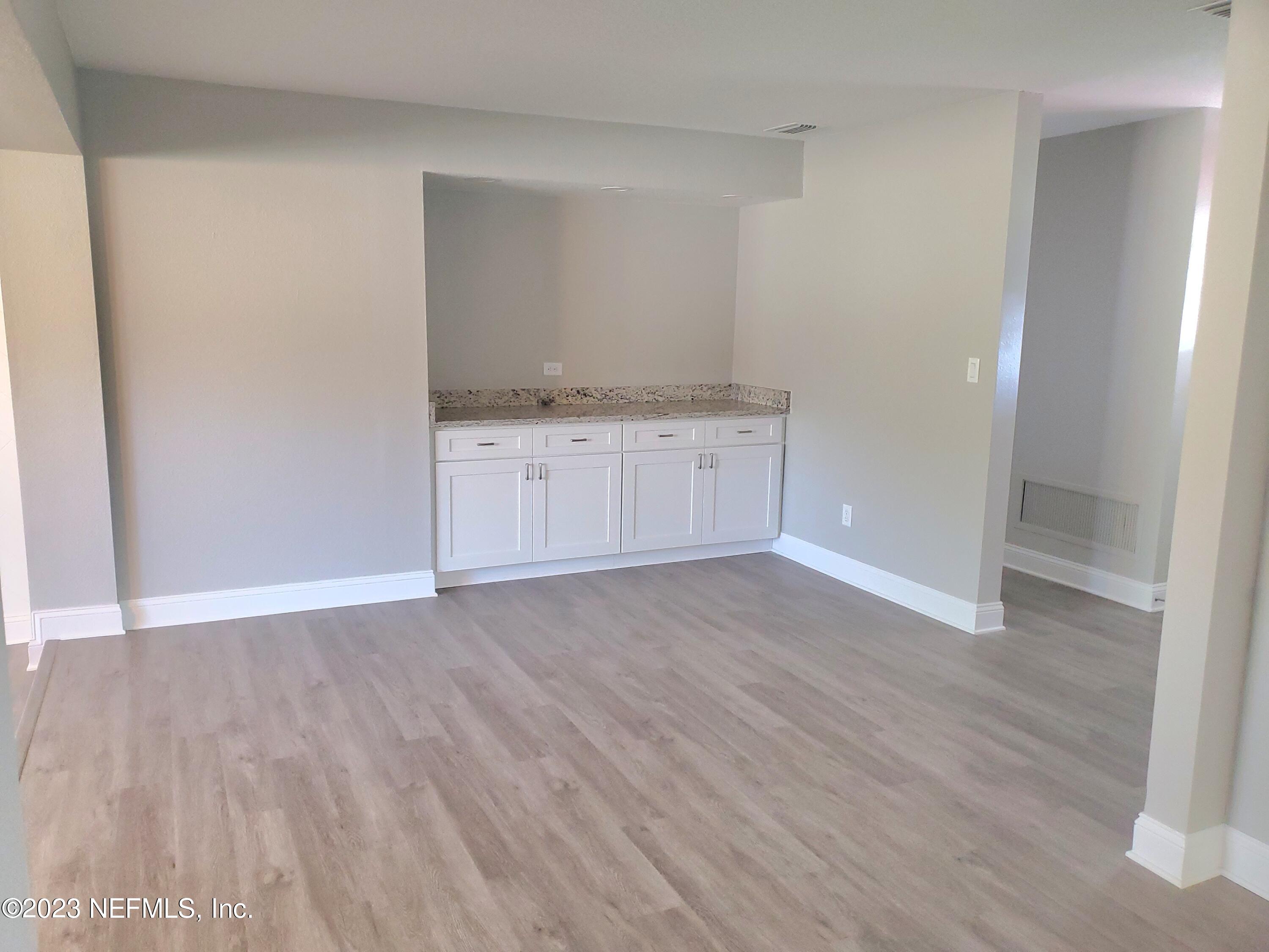 2305 Brest Road Jacksonville, FL 32216 - Photo 5 of 32 a view of an empty room and wooden floor