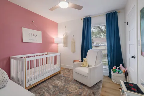 a bedroom with furniture and a window