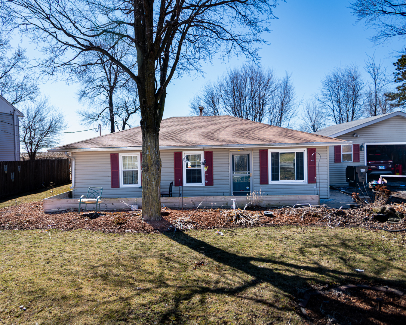 13610 137th Avenue West Taylor Ridge, IL 61284 - Photo 1 of 24 a view of a yard with large tree