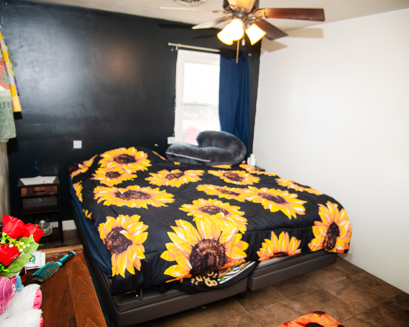 13610 137th Avenue West Taylor Ridge, IL 61284 - Photo 11 of 24 a bedroom with a bed and a chandelier