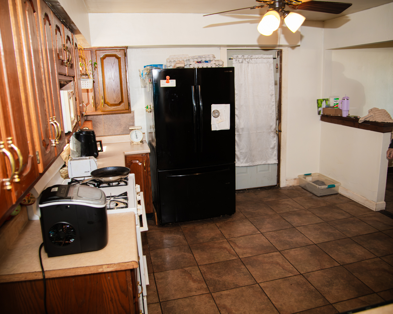 13610 137th Avenue West Taylor Ridge, IL 61284 - Photo 13 of 24 a kitchen with a stove and a refrigerator
