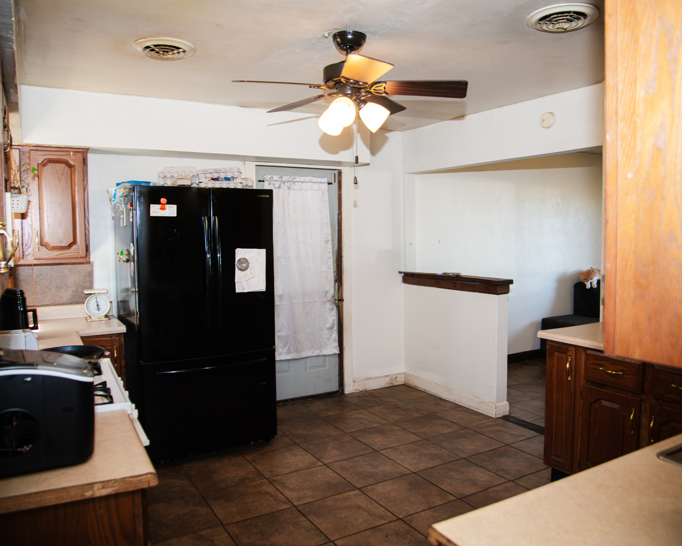 13610 137th Avenue West Taylor Ridge, IL 61284 - Photo 17 of 24 a bedroom with a bed and a chandelier