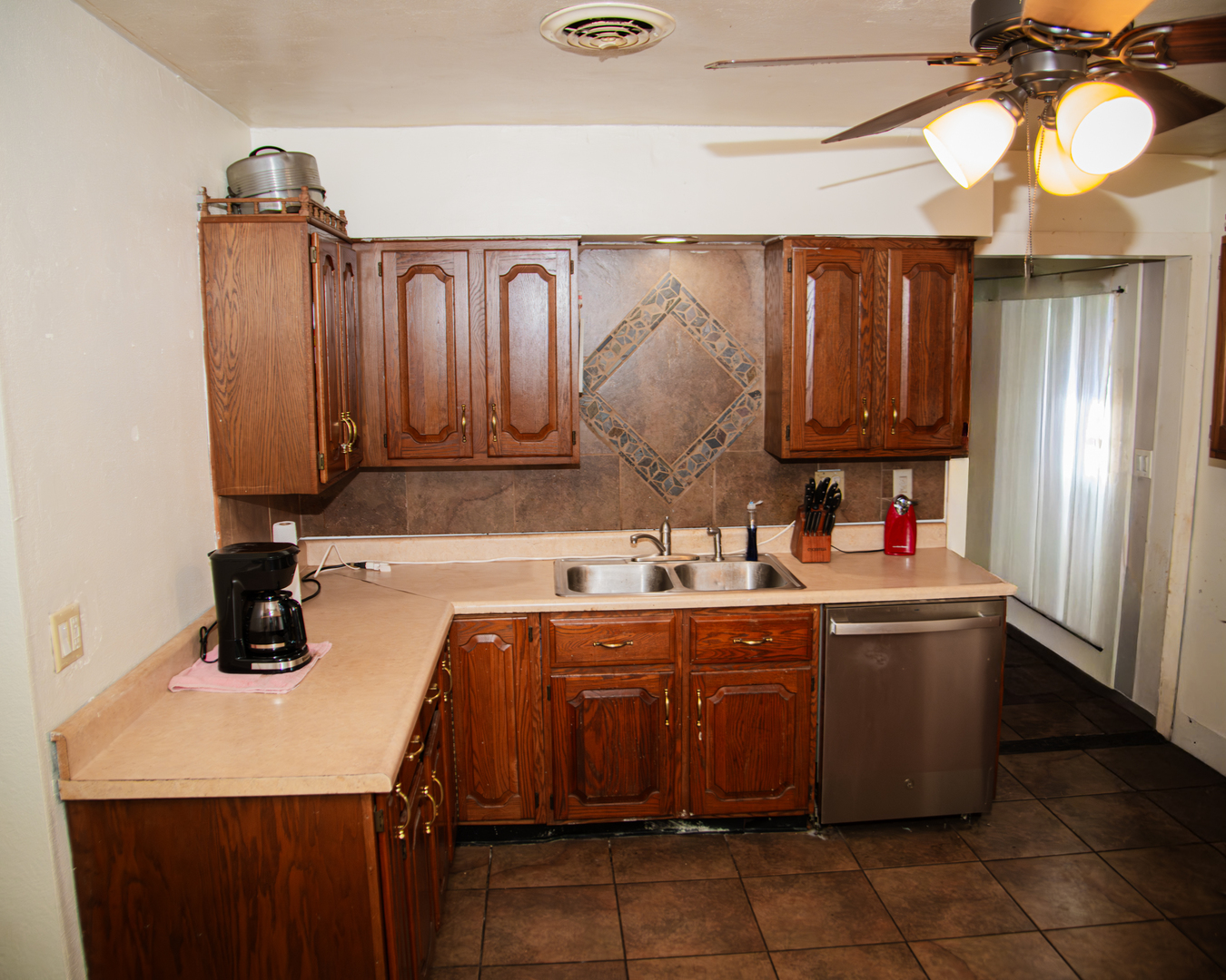 13610 137th Avenue West Taylor Ridge, IL 61284 - Photo 18 of 24 a kitchen with a sink and cabinets
