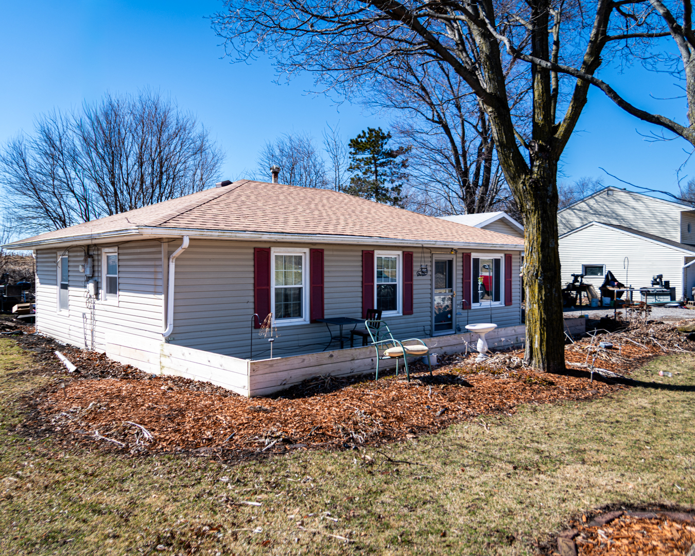 13610 137th Avenue West Taylor Ridge, IL 61284 - Photo 2 of 24 a front view of a house with garden