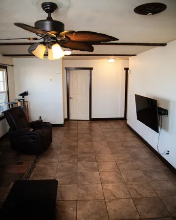 a view of entryway with a ceiling fan