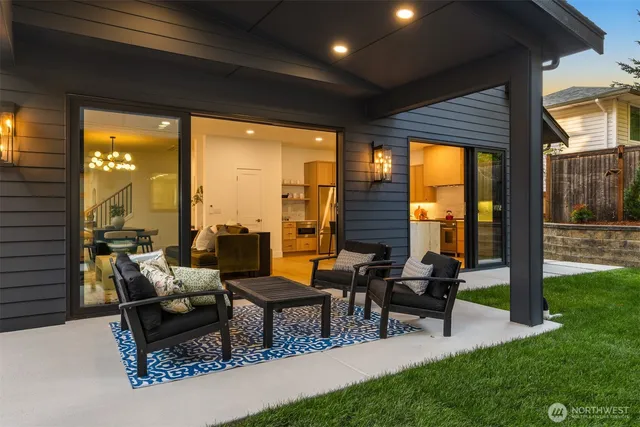 a building outdoor space with patio furniture and garden