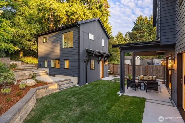 a front view of a house with a yard table and chairs