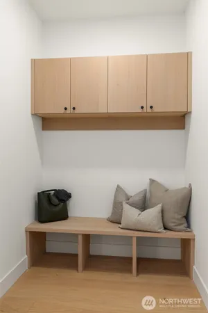 a living room with furniture and cabinets