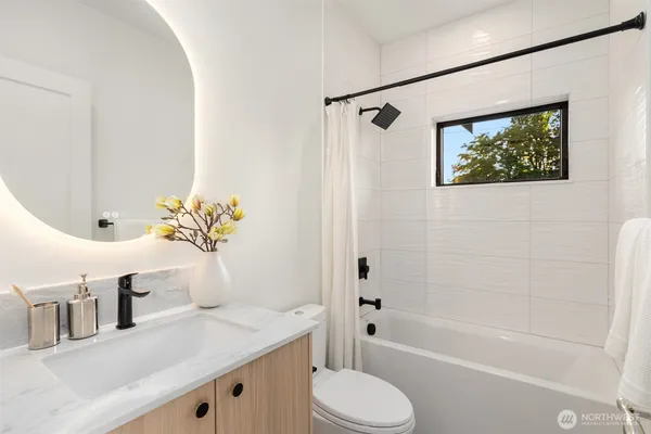 a bathroom with a sink a toilet and a bathtub