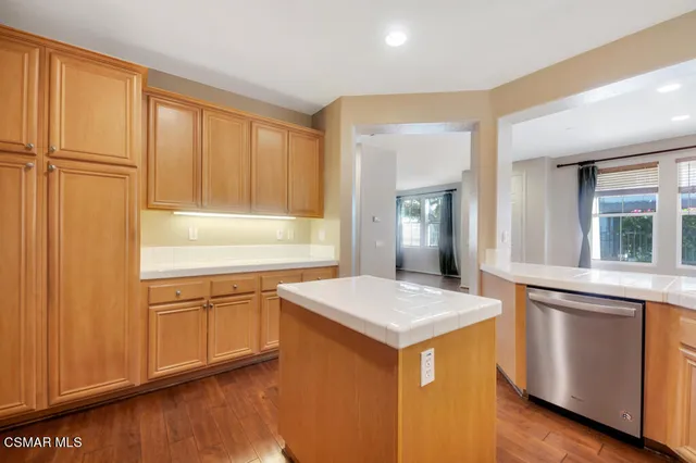 a kitchen that has a sink and a stove in it