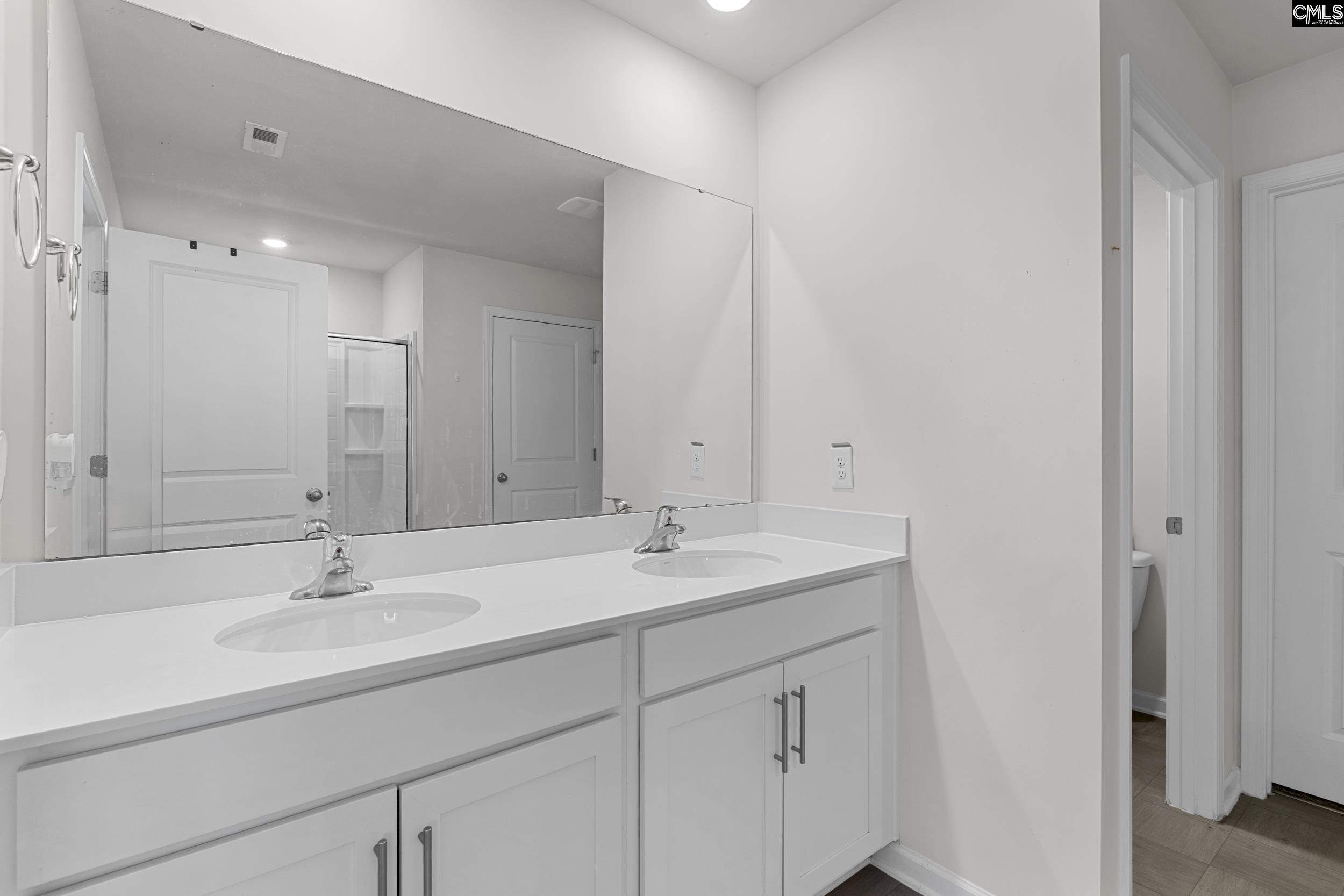 2097 Elmridge Road Columbia, SC 29209 - Photo 5 of 9 a bathroom with a sink and a mirror