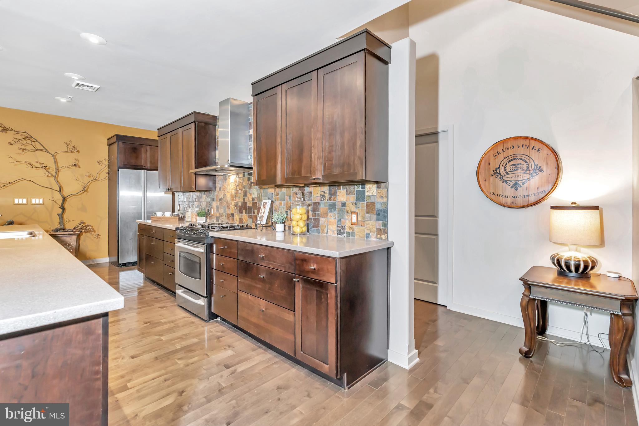 118 Bancroft Mills Road Wilmington, DE 19806 - Photo 11 of 40 a kitchen with stainless steel appliances granite countertop a stove and a refrigerator