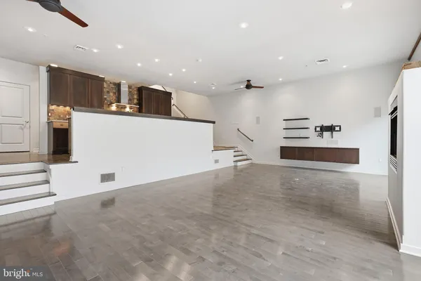 a view of kitchen and kitchen with stainless steel appliances