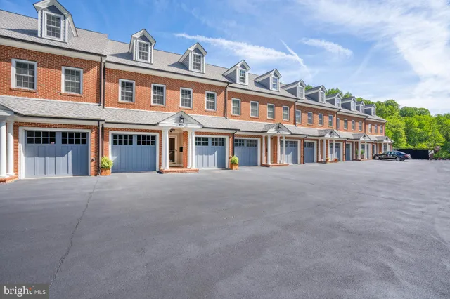 a front view of residential houses with yard