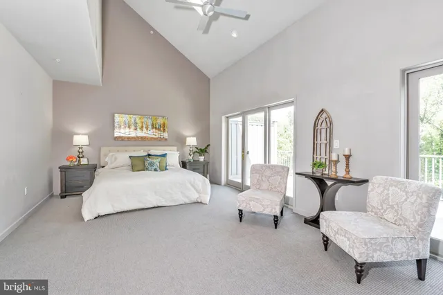 a bedroom with bed and window