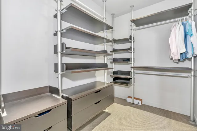 a large white bathroom with a granite countertop sink mirror and a bathtub