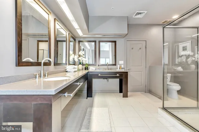 a spacious bathroom with a bathtub and a sink