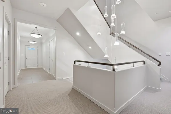 a view of a hallway with staircase