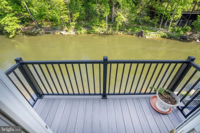 a bedroom with furniture and a large window