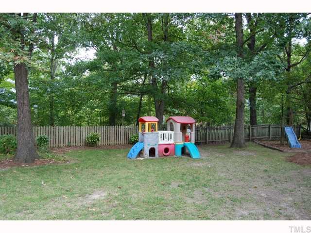7516 Deer Track Drive Raleigh, NC 27613 - Photo 10 of 11 Nicely Landscaped Back Yard with Beautiful Shade Trees.