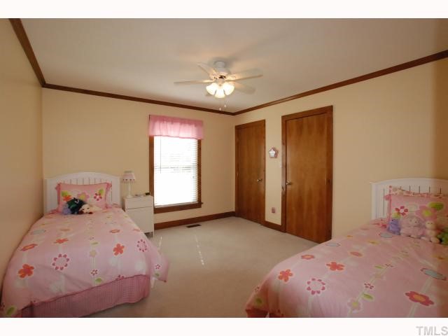 7516 Deer Track Drive Raleigh, NC 27613 - Photo 7 of 11 Bedroom 2 & 3 both have Ceiling Fans, Plantation Blinds & Spacious Closets with Organizers.