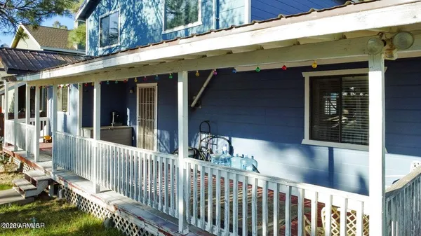 a view of a porch with wooden floor