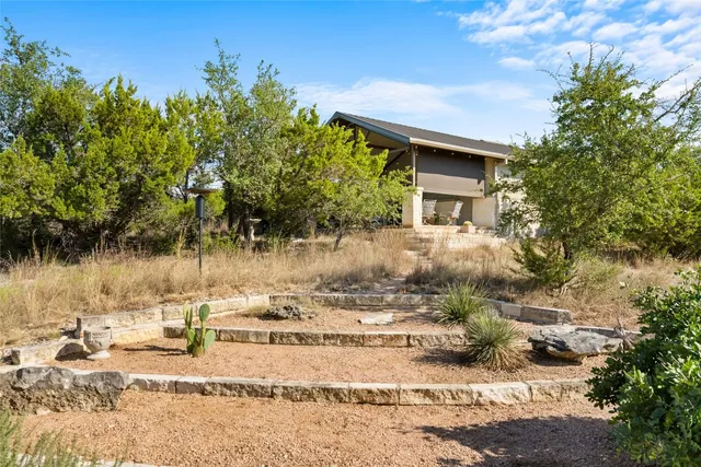 a backyard of a house with lots of green space