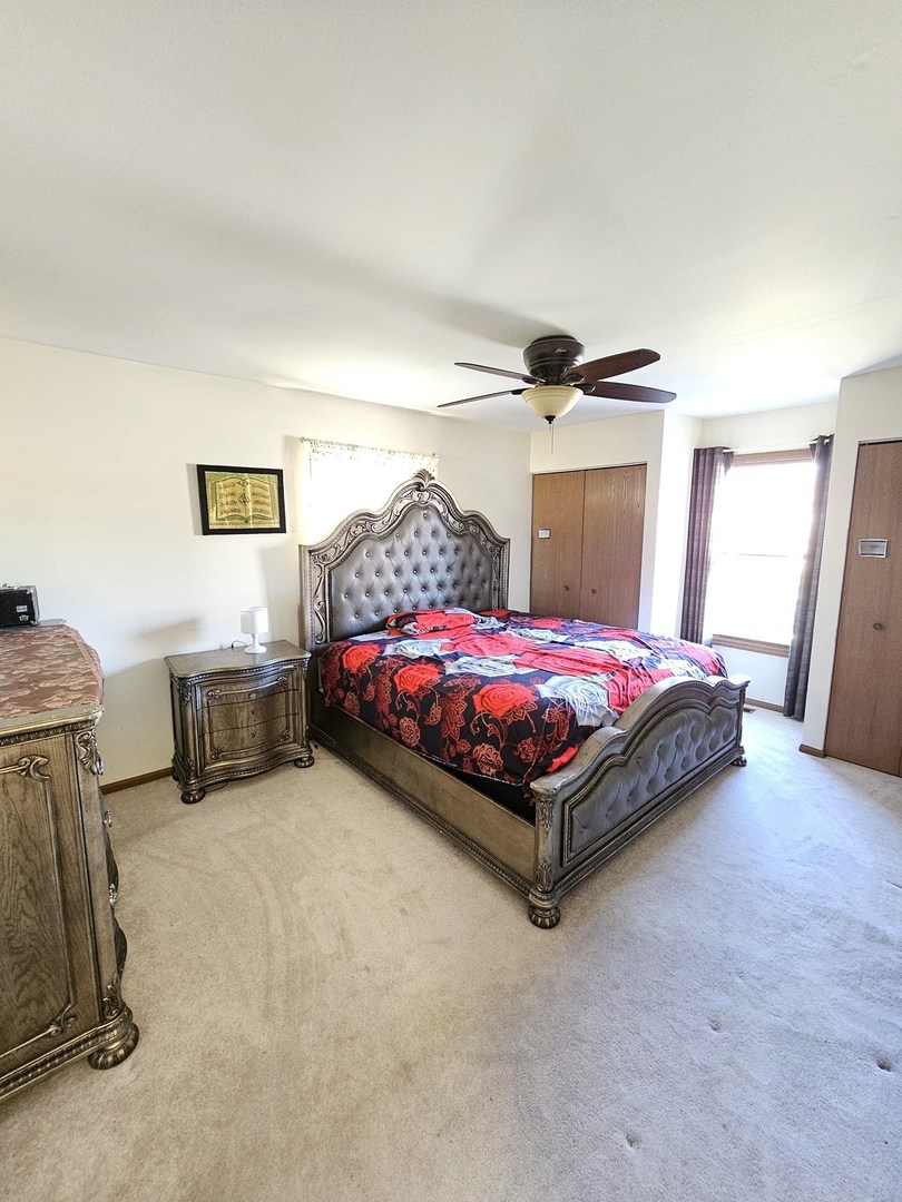 1529 Lighthouse Drive Naperville, IL 60565 - Photo 14 of 21 a bedroom with a bed and a cabinets