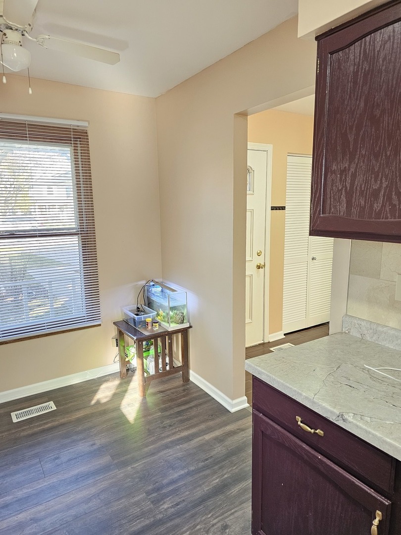 1529 Lighthouse Drive Naperville, IL 60565 - Photo 8 of 21 a view of a dining room with furniture and wooden floor