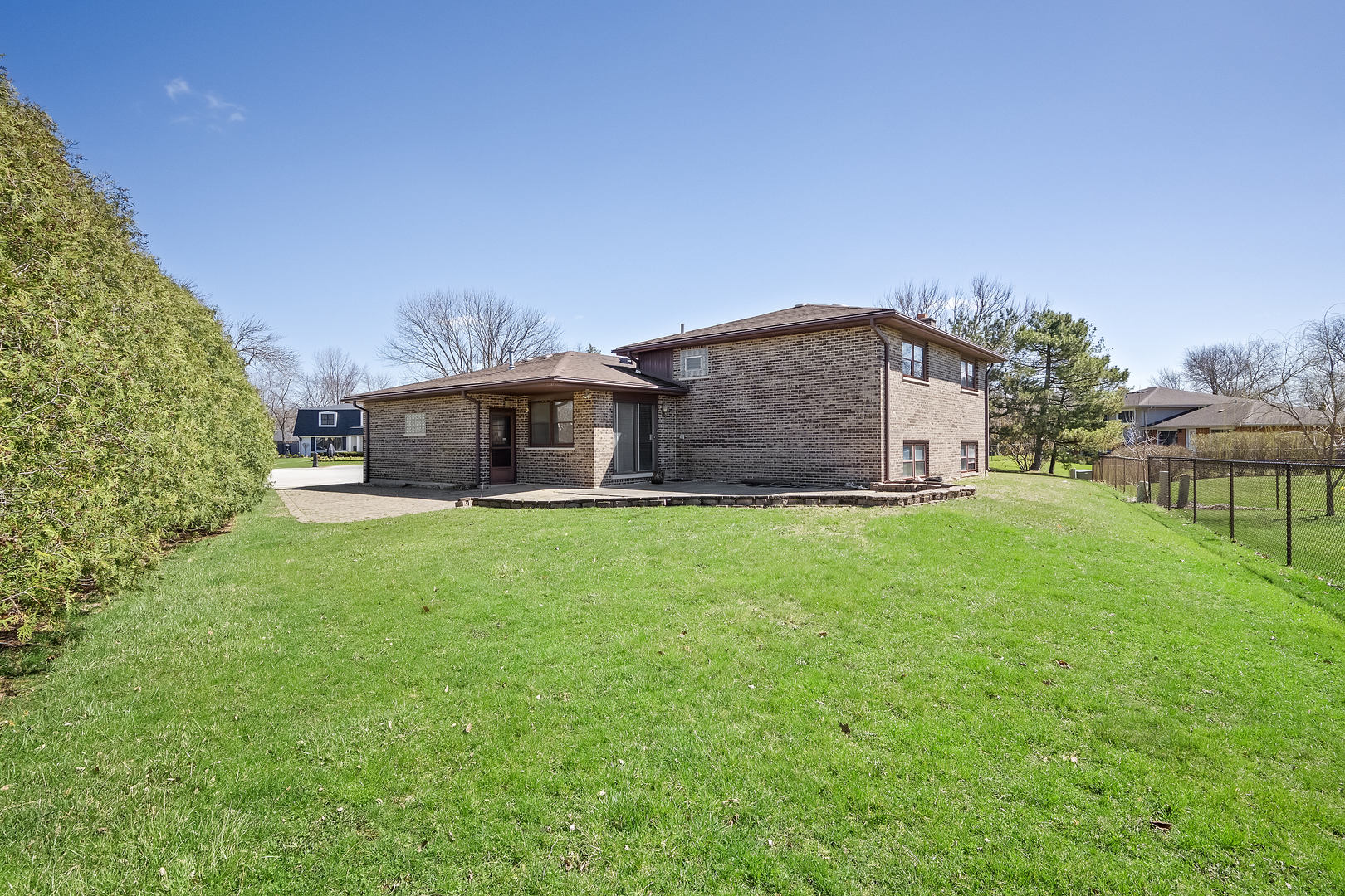 1631 Arbor Court Darien, IL 60561 - Photo 6 of 7 a backyard of a house with lots of green space and fountain