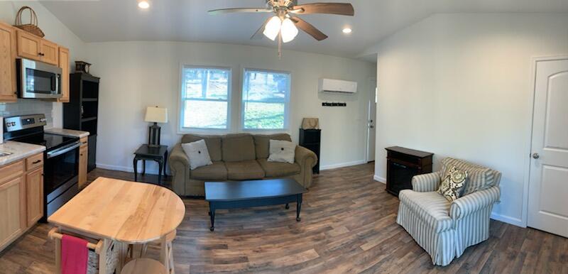 150 Idlewood Road Hardy, VA 24101 - Photo 3 of 24 a living room with furniture a fireplace and a flat screen tv