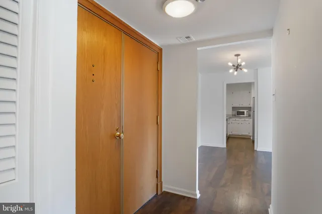 a kitchen with stainless steel appliances a refrigerator sink and stove