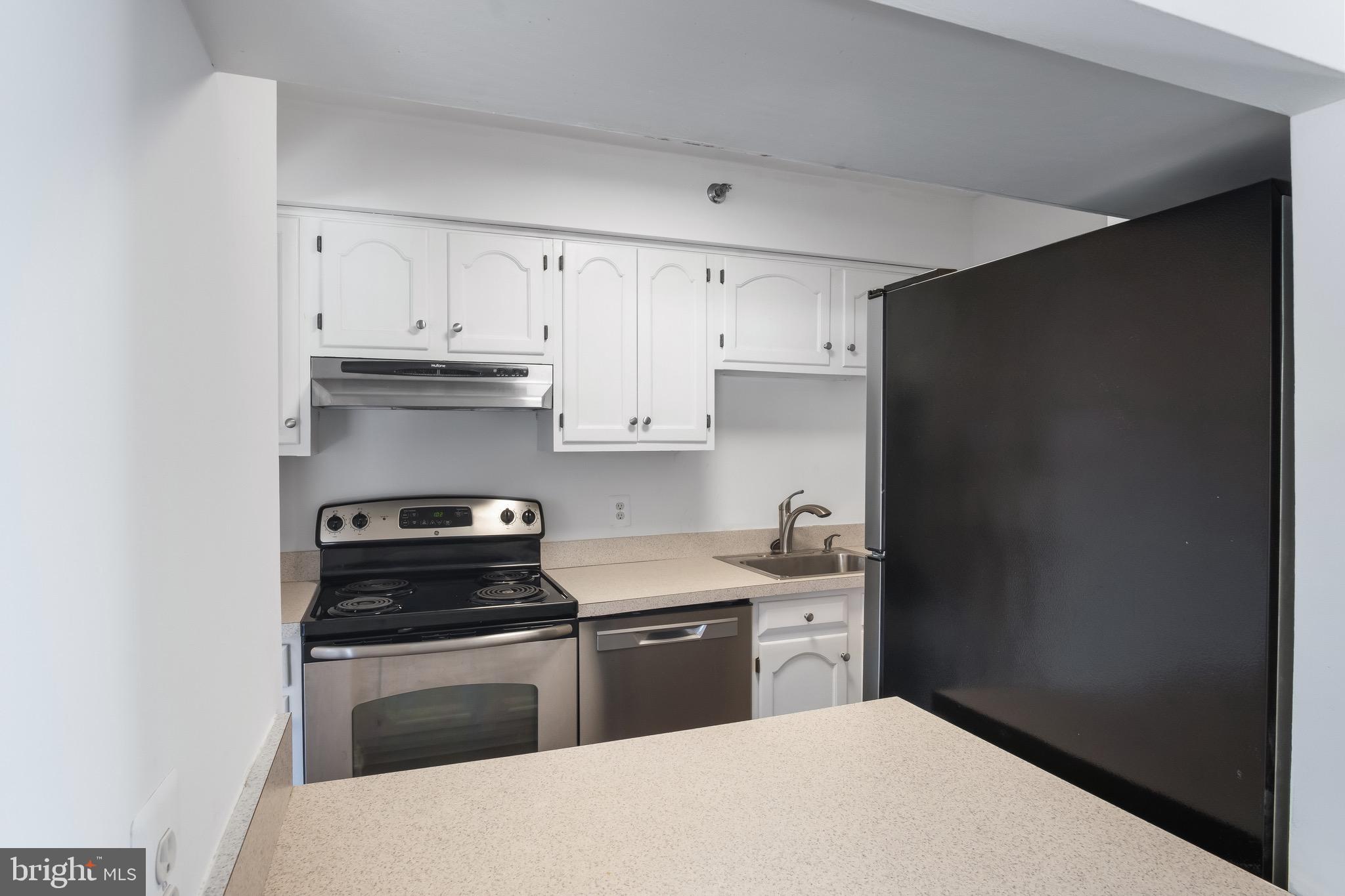 1301 North Courthouse Road, Unit 1401 Arlington, VA 22201 - Photo 17 of 34 a kitchen with a sink and cabinets