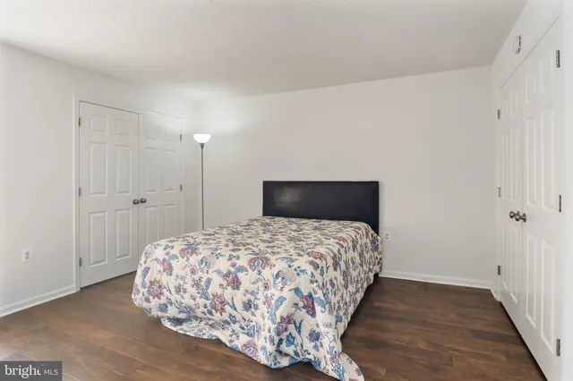 a bathroom with a sink mirror and shower