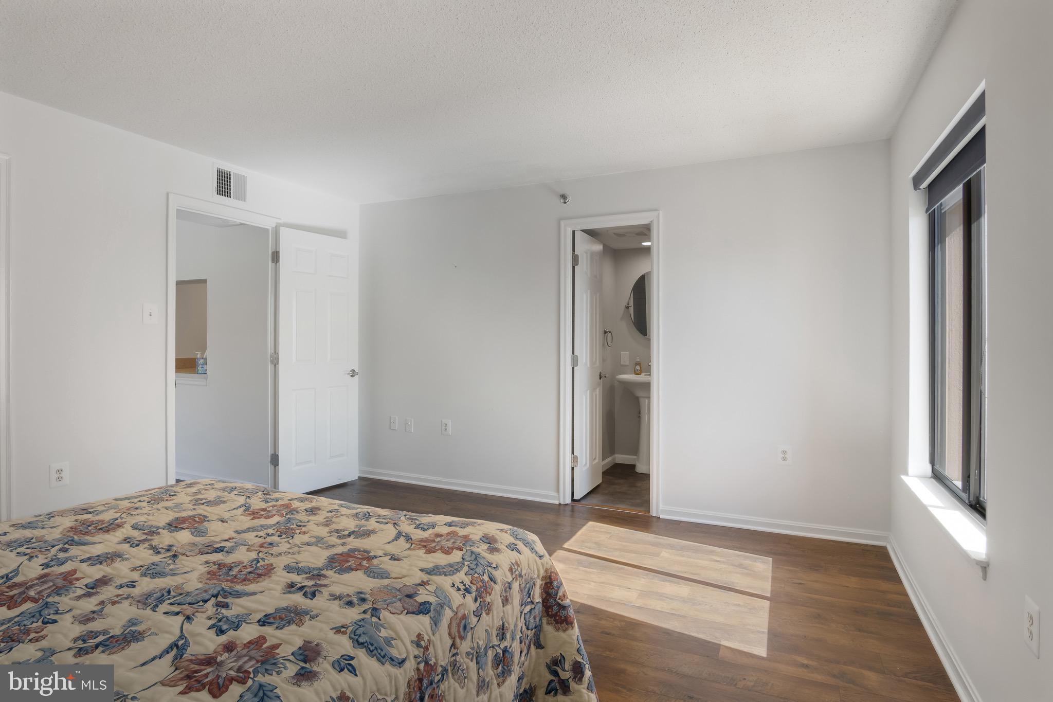 1301 North Courthouse Road, Unit 1401 Arlington, VA 22201 - Photo 20 of 34 a bedroom with a bed and a window
