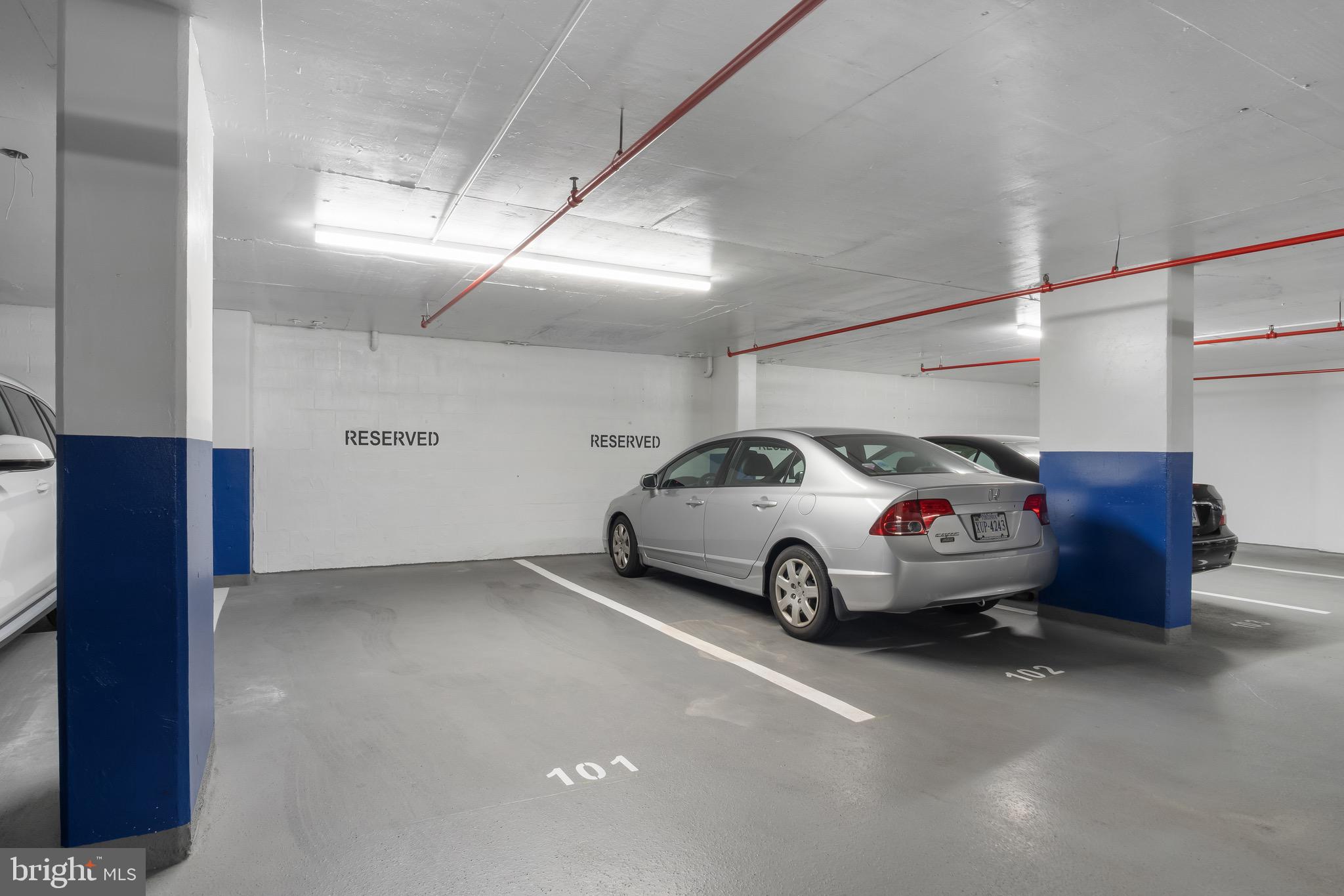 1301 North Courthouse Road, Unit 1401 Arlington, VA 22201 - Photo 23 of 34 a car parked in a parking garage