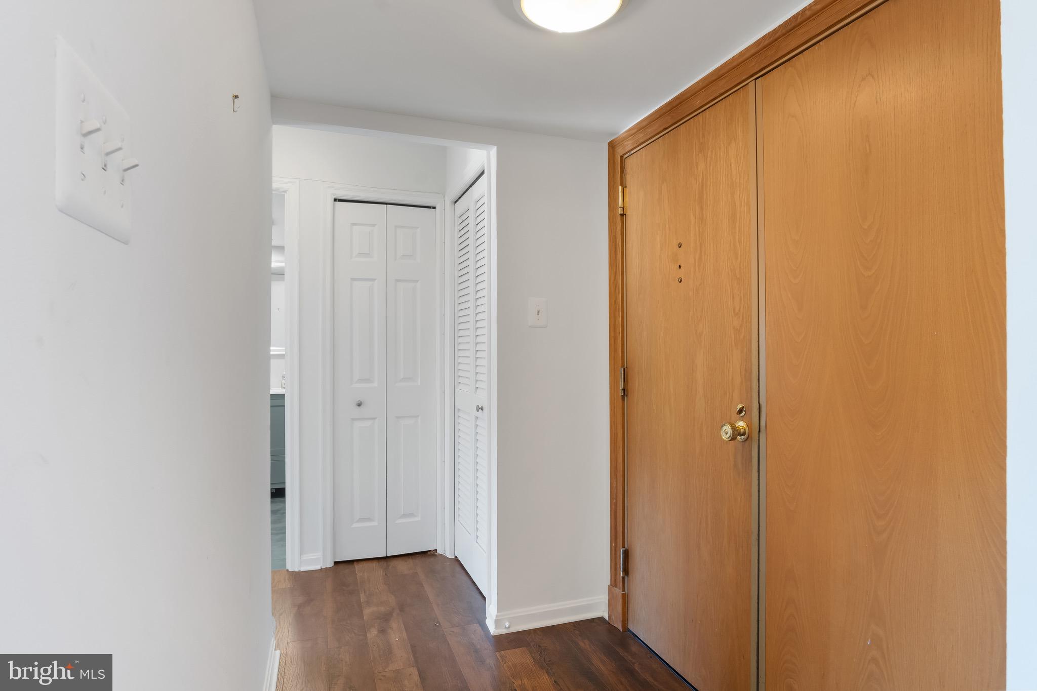 1301 North Courthouse Road, Unit 1401 Arlington, VA 22201 - Photo 9 of 34 a view of a hallway with wooden floor