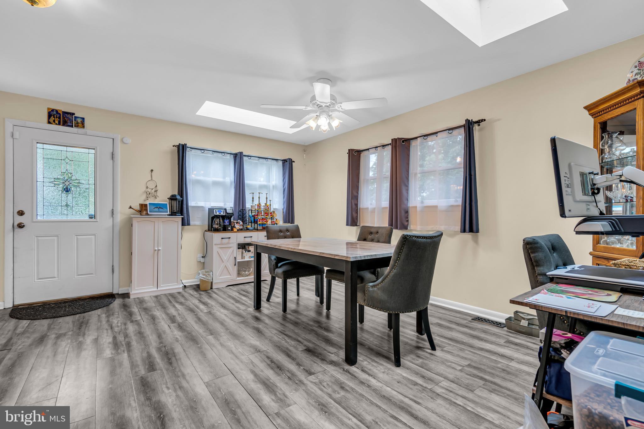 733 Buck Road Monroeville, NJ 08343 - Photo 11 of 24 a view of a dining room with furniture and wooden floor