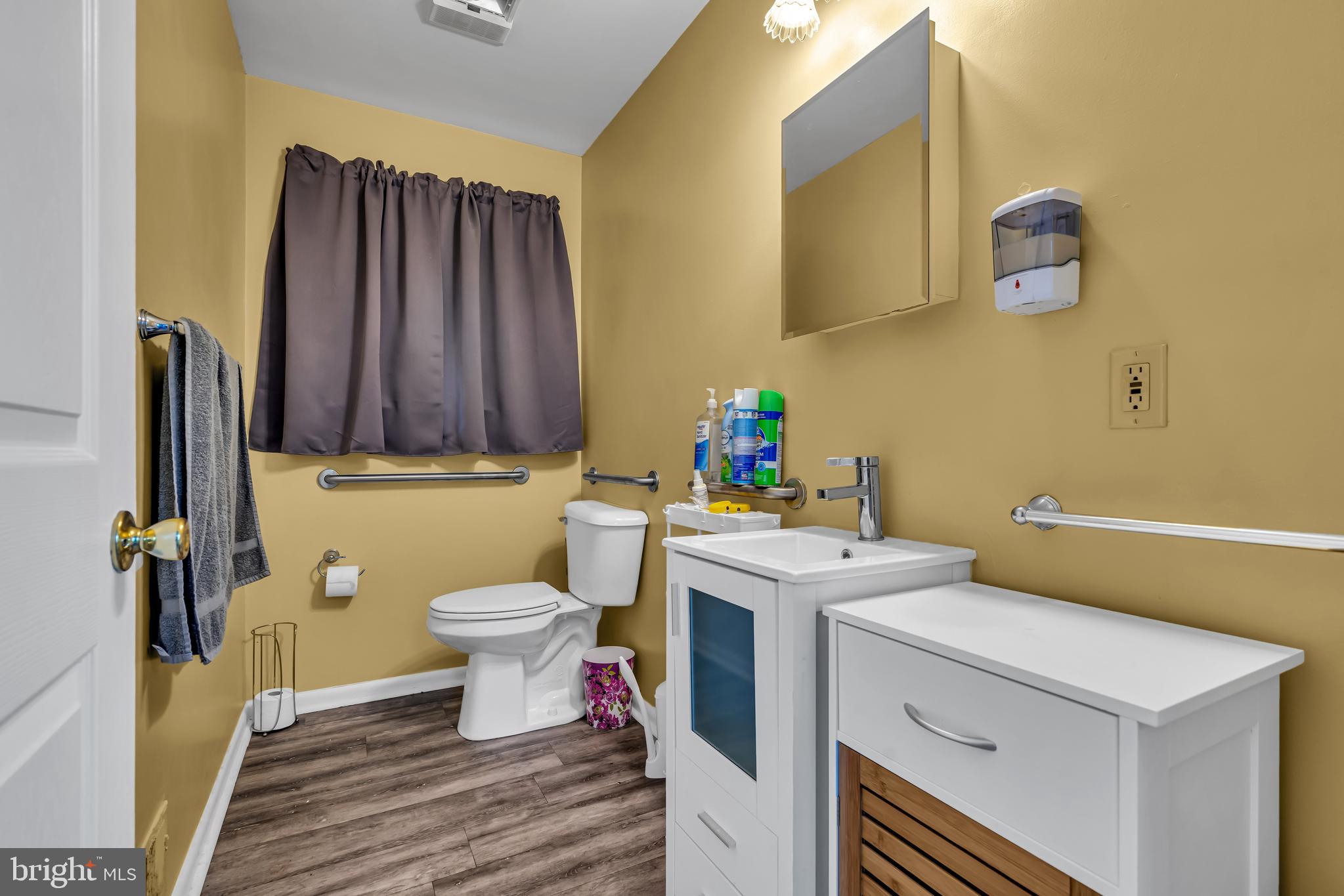 733 Buck Road Monroeville, NJ 08343 - Photo 12 of 24 a bathroom with a sink toilet and vanity