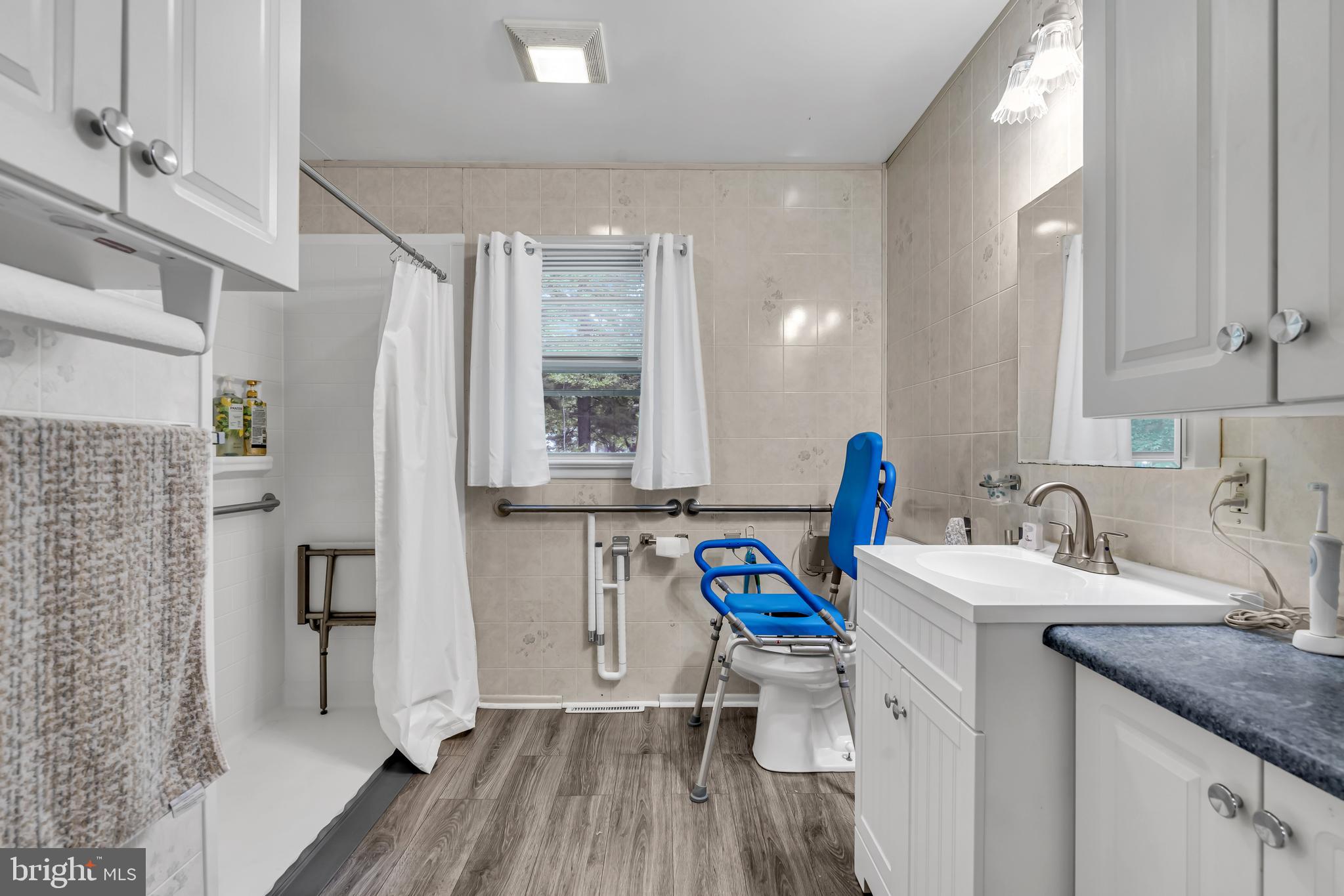 733 Buck Road Monroeville, NJ 08343 - Photo 13 of 24 a view of a kitchen with a sink and wooden floor