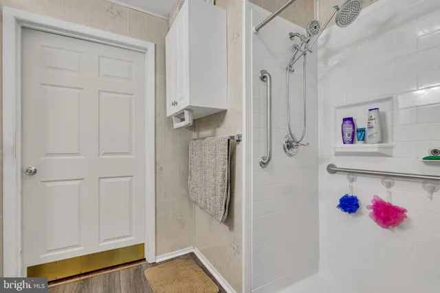 a bathroom with a cabinets and a shower