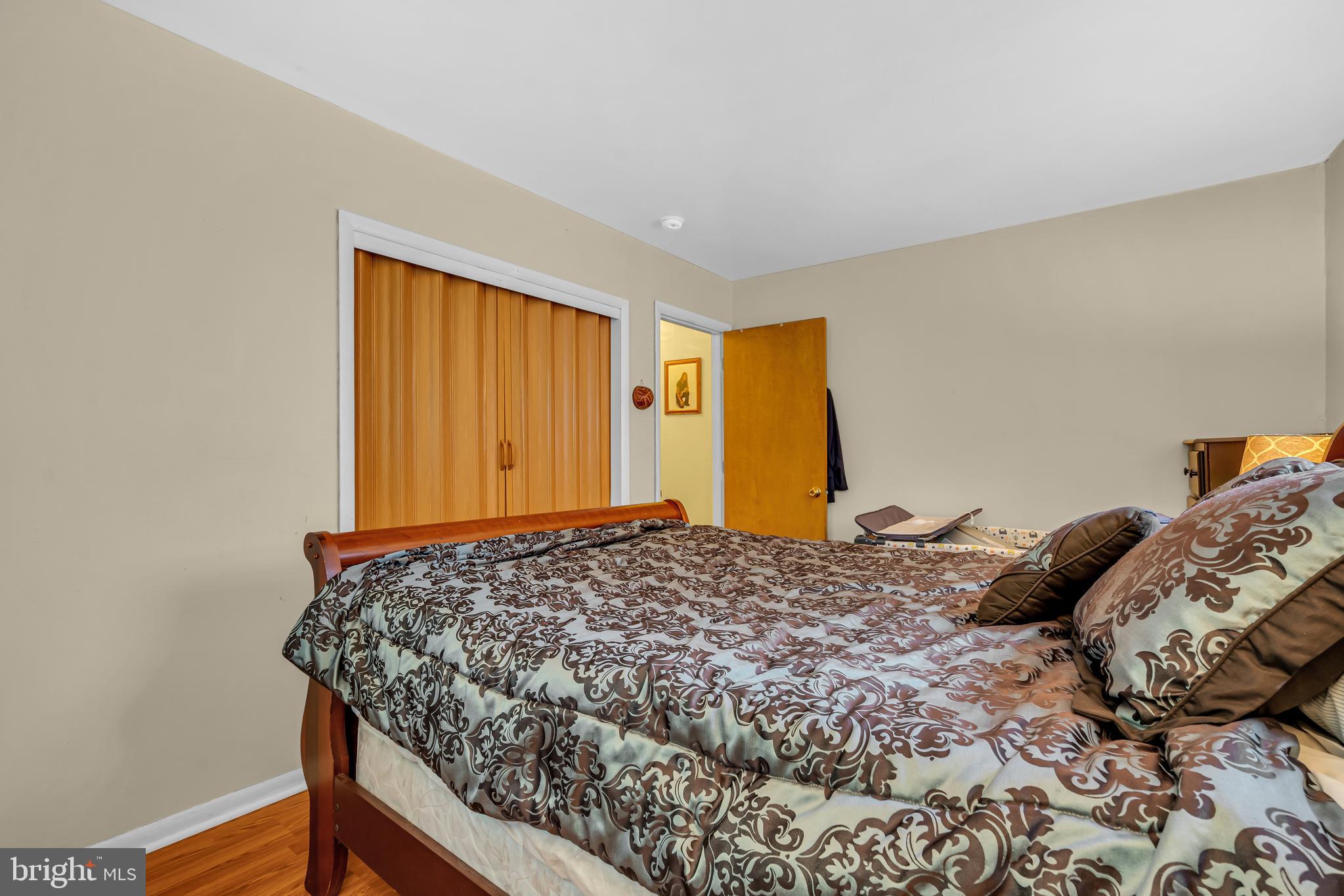 733 Buck Road Monroeville, NJ 08343 - Photo 19 of 24 a bedroom with a bed and dresser