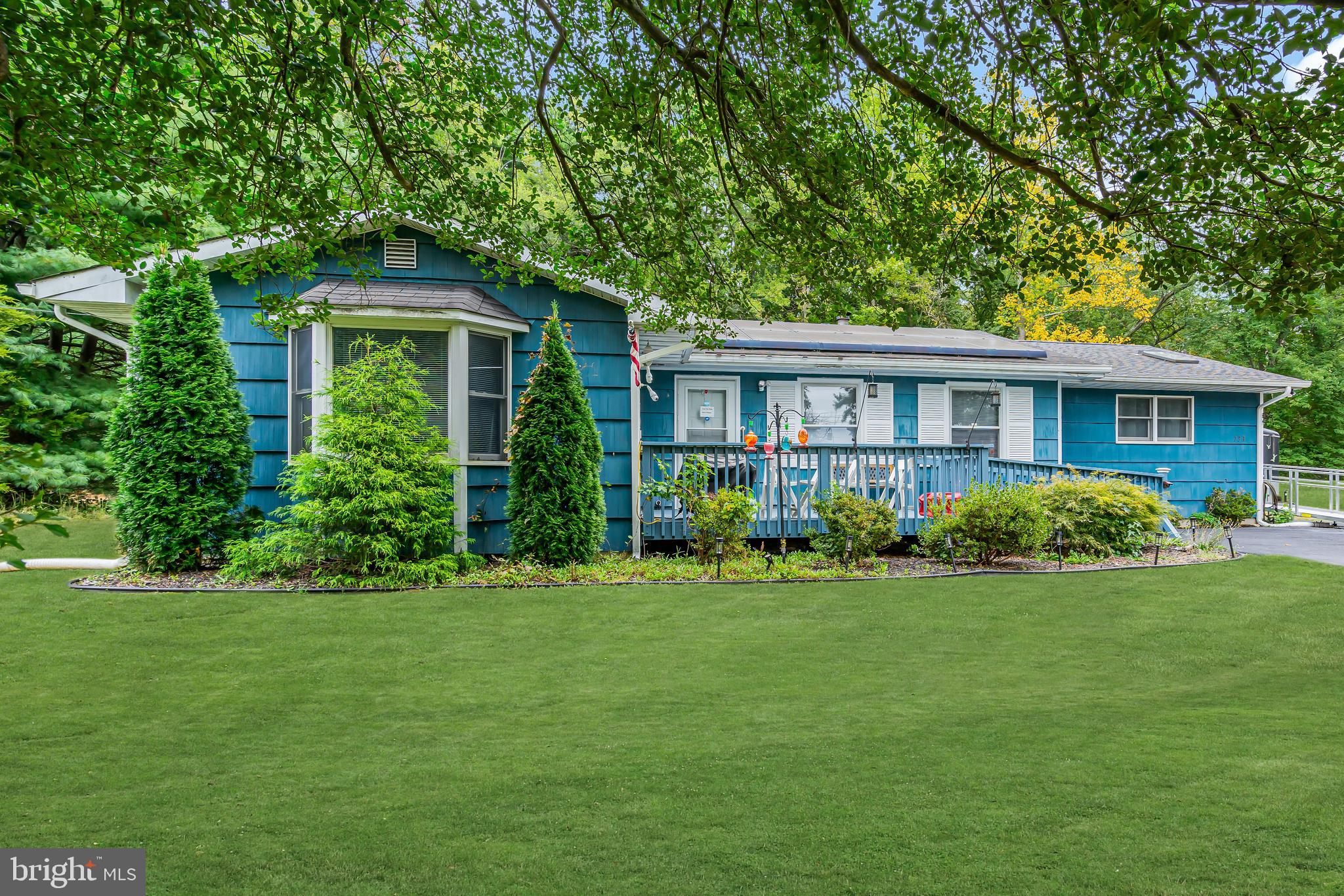 733 Buck Road Monroeville, NJ 08343 - Photo 2 of 24 a front view of a house with a garden