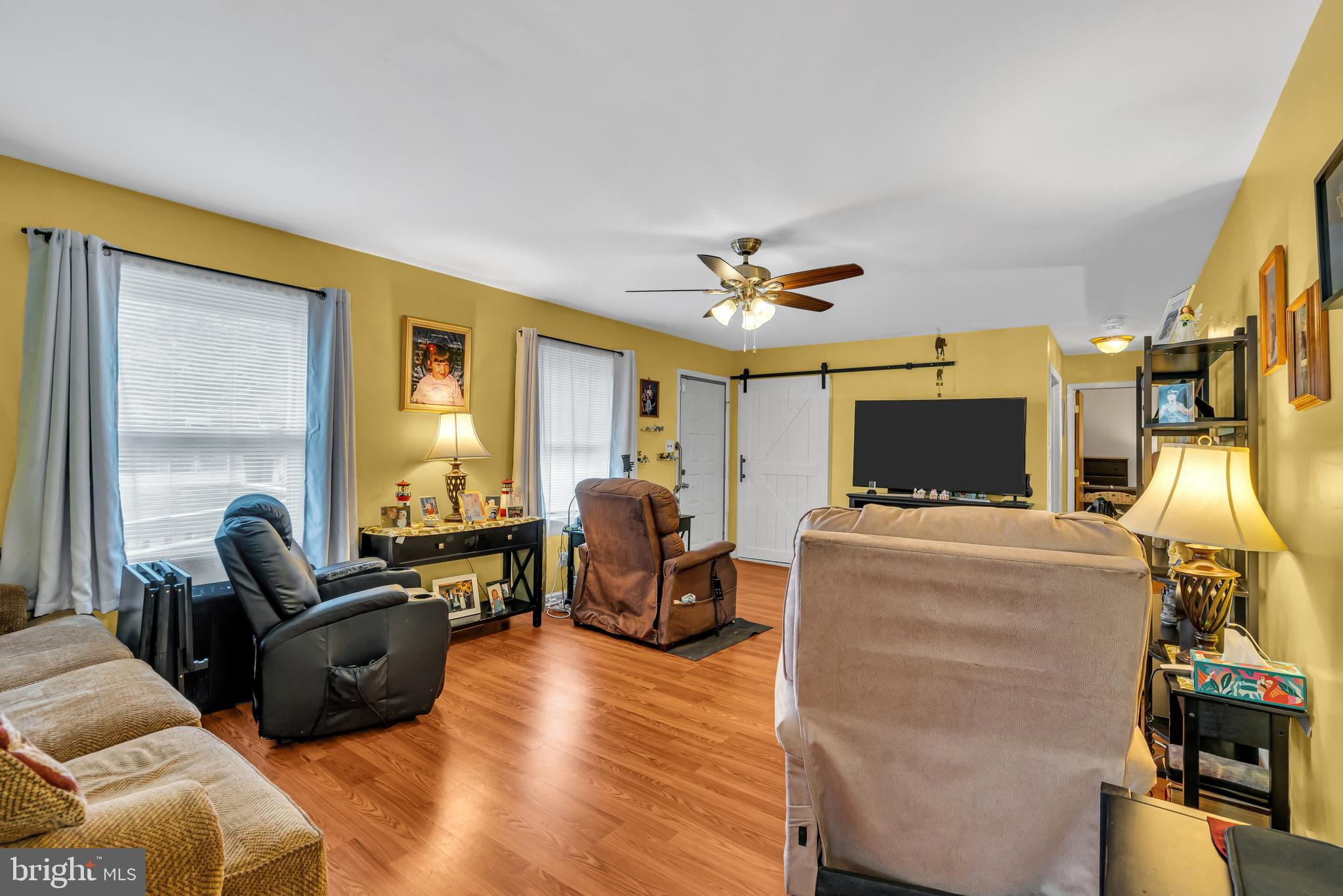 733 Buck Road Monroeville, NJ 08343 - Photo 5 of 24 a living room with furniture and a flat screen tv