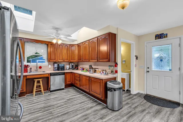 a kitchen with a sink and wooden cabinets