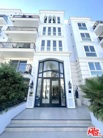 a view of a car park in front of house