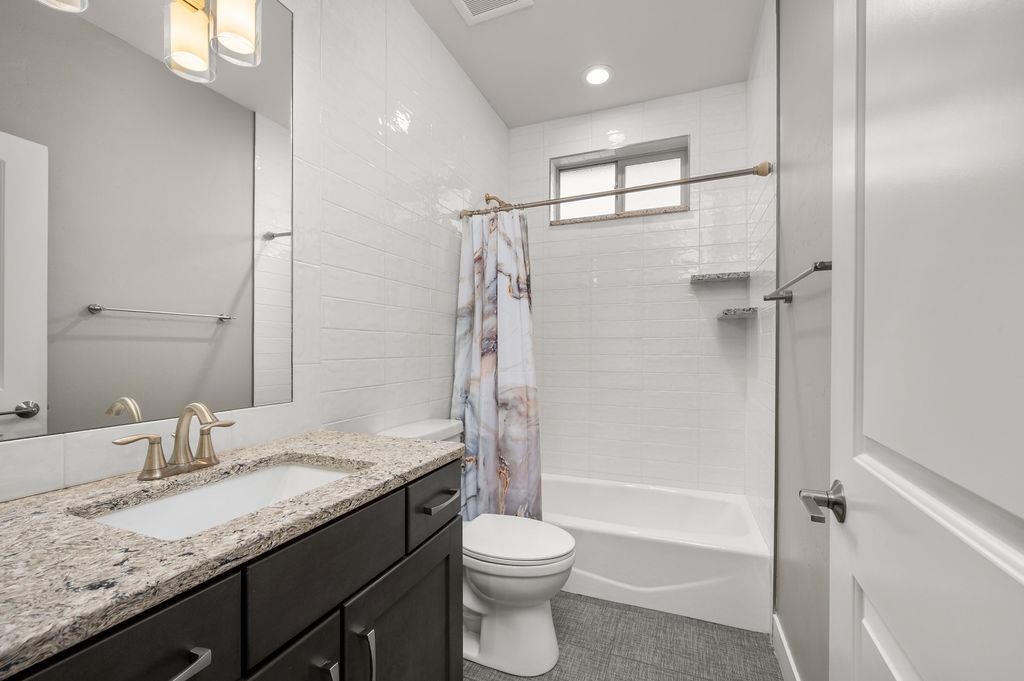 2592 Jay Court Grand Junction, CO 81505 - Photo 34 of 42 a bathroom with a granite countertop sink toilet and shower