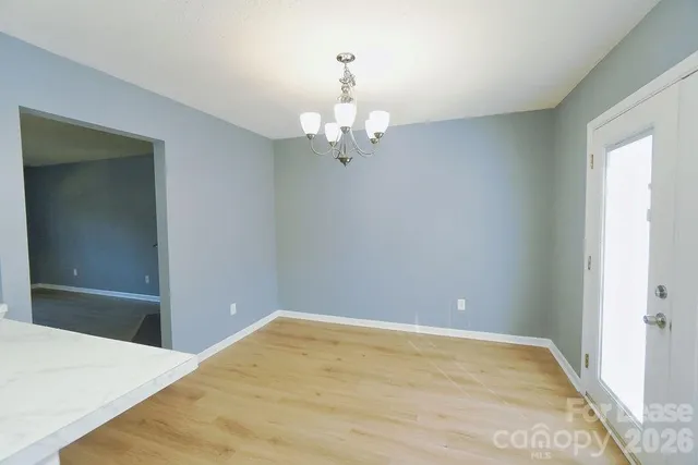 a view of a chandelier in an empty room