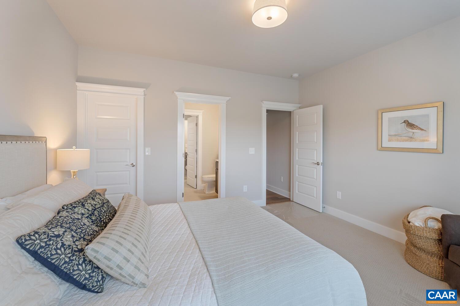 4 Jarmans Gap Road, Unit LOT 4 JARMANS GAP Crozet, VA 22932 - Photo 11 of 47 a bedroom with a bed and a lamp