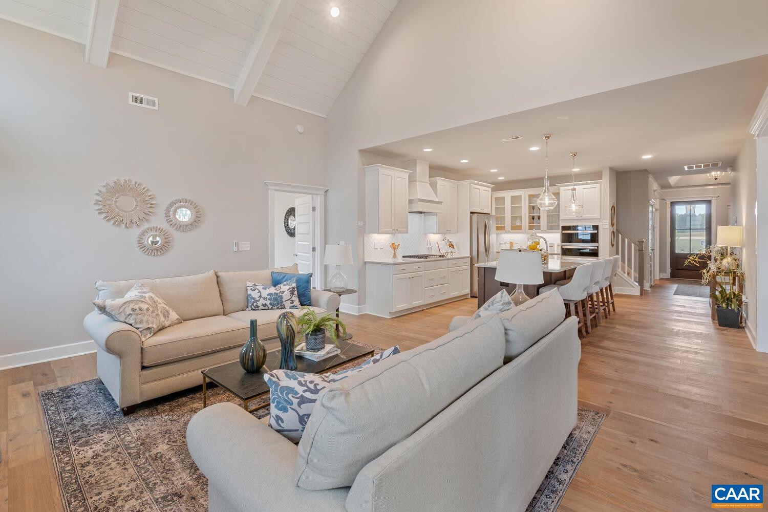 4 Jarmans Gap Road, Unit LOT 4 JARMANS GAP Crozet, VA 22932 - Photo 38 of 47 a living room with furniture wooden floor and a large kitchen view